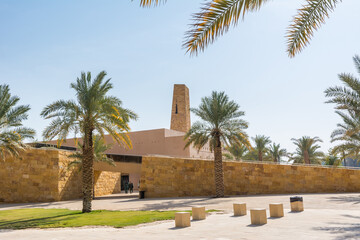 Fototapeta na wymiar Palm trees and buildings of Diraiyah, also as Dereyeh and Dariyya, a town in Riyadh, Saudi Arabia, was the original home of the Saudi royal family, and served as the capital of the Emirate of Diriyah.