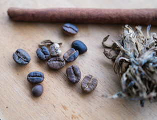 focus on coffee bean on wooden table with blurred background