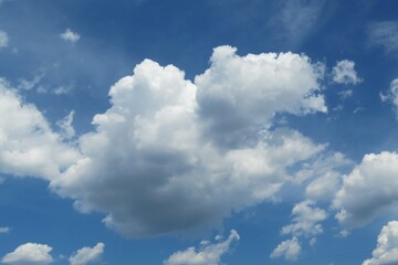 Naklejka na ściany i meble Blue sky with big fluffy cloud