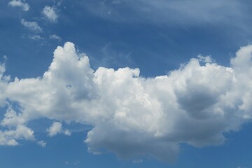 Naklejka na ściany i meble Blue sky with big fluffy cloud