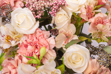 Bouquet of  soft pink flowers in wrapping paper.