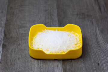 fresh raw vermicelli sliced on square plate  on wood, wooden background,set shabu, hot pot ingredients.