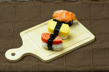 Sushi Set sashimi and sushi rolls served on wood background