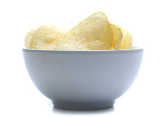 Potato chips on bowl isolated on white