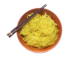 yellow noodles on bowl isolated on white background