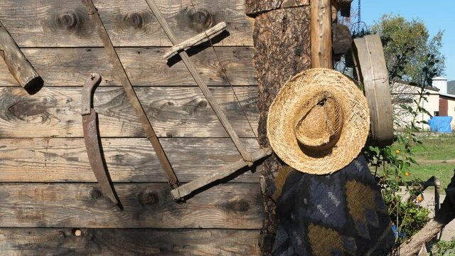 A saw and a hat are decorations on a cowboy hut near Juve