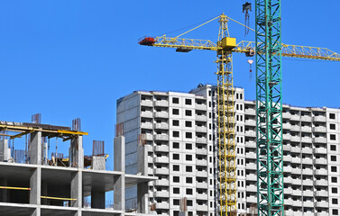 Crane and highrise construction site