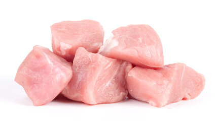 Pile of pork uncookes chopped cubes close up isolated on white background