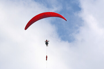 Paraglider being towed on a winch launch	