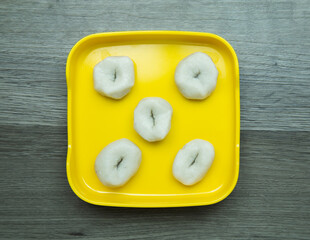 fresh raw meat ball sliced on square plate  on wood, wooden background,set shabu, hot pot ingredients.