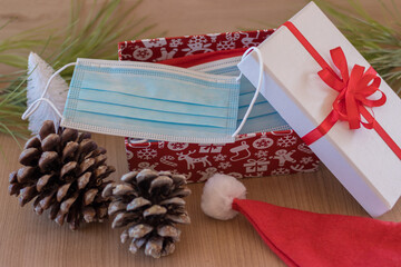 Christmas present with a surgical mask inside, pandemic times at christmas
