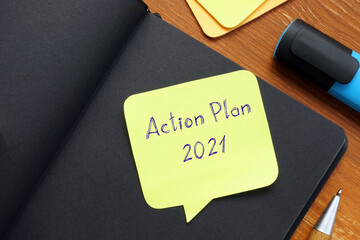 Conceptual photo about Action Plan 2021 with handwritten text.