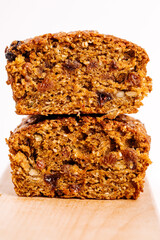 Pumpkin bread loaf sitting on wooden cutting board 