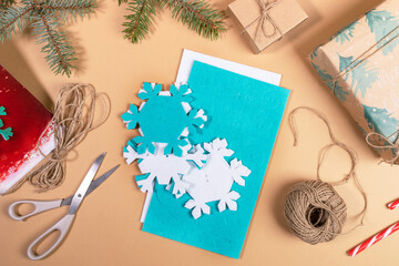 Step by step instruction of making DIY Xmas toy snowflake. Step 2 - Take out substrates with applied snowflakes.