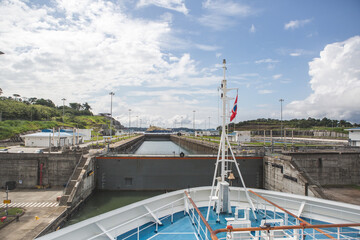 Side way look on Gatun lock from ships bow with closed gate and high water level 