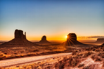 Plakat Monument Valley in Navajo National Park at Sunrise, Border of Utah and Arizona