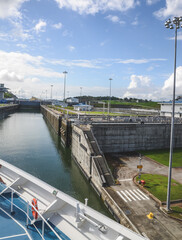 Panama Chanel gates and ship bow entering open gate 