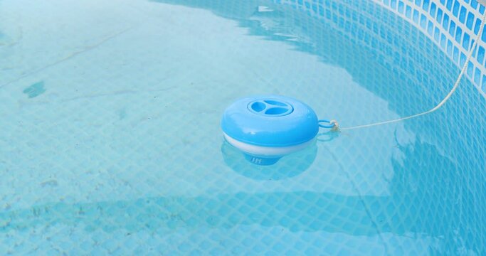 Worker hands isinfection and chlorination of water in the pool. Purification from pollution pool chlor dispenser.