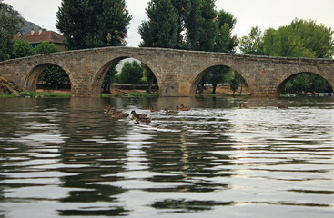 Old bridge over river in Spain, Europe