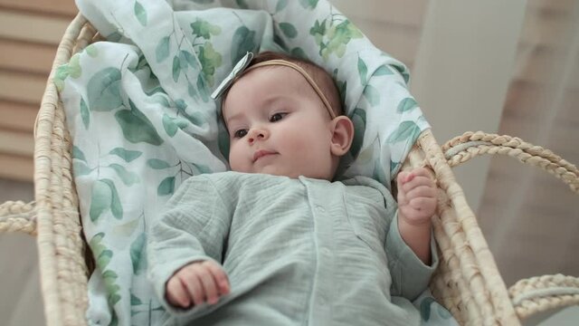 Happy Kid, Baby Care, Stay at Home, Comfort and Joy. Little baby woke up in the morning lying in the cradle