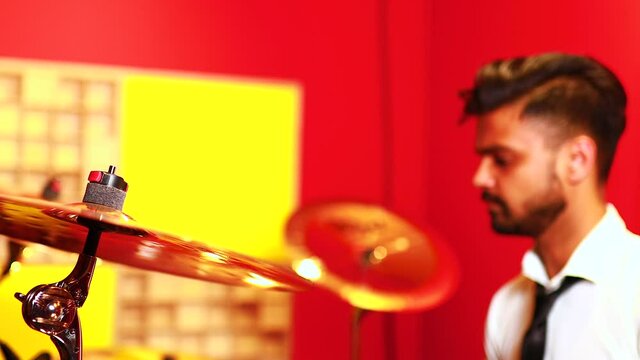 italian artist musician playing drumms during online concert at studio