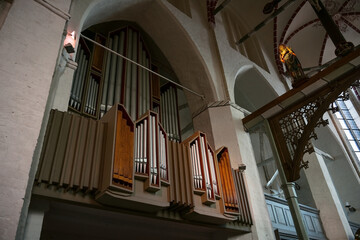 Pipe organ and wooden sculpture of the Virgin Mary in the town church of Gadebusch in northern...