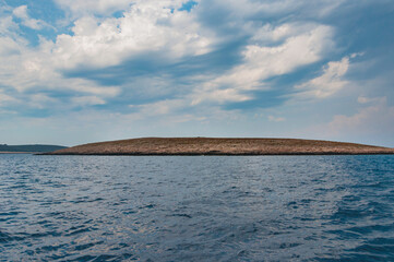 A photo of the Croatian rocky island seen from the yacht