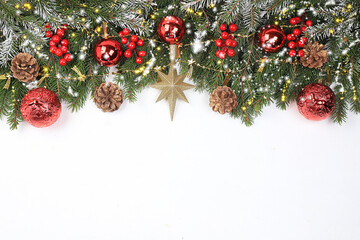 Christmas and New Year background with bokeh lights and decorations, toys with fir branches in snow flakes, place for text. Holiday card, selective focus, banner