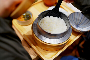 Tonkatsu of pork and vegetables with rice is a famous delicious Japanese food, Rice in a pot