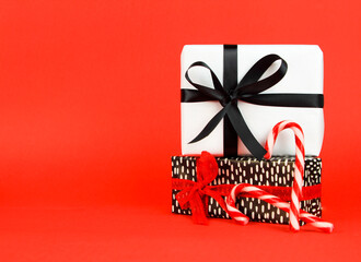 Gifts with Christmas decoration on red background