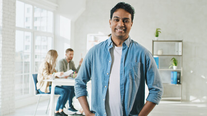 Indian Man Smilling at Work Portrait. Man in Creative Office. Sunny Day at Work in Office.