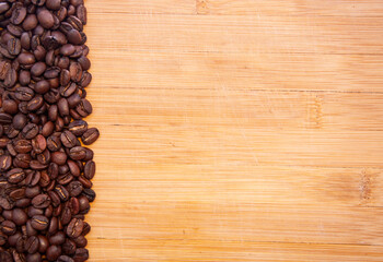 Dark roast coffee beans background, top view