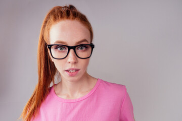 Fototapeta premium redhair ginger woman wearing glass in studio background fish eye