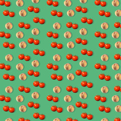 Tomatoes and peaches pattern on green background