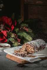 Homemade chocolate sausage on a wooden background