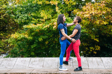 Middle aged lesbian couple enjoying together in the park