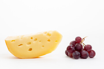 Big holes cheese on white background