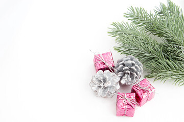 Christmas decorations on a white background. Winter holidays decoration concept. Delicate blank for a Christmas card. Copy space. Flat layout.