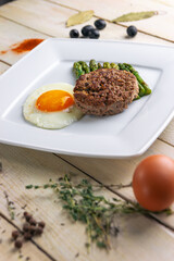 Beautiful juicy healthy food from the chef for an expensive restaurant delicious dishes for guests with a beautiful presentation, fish delicacies, delicious meat with asparagus food photo