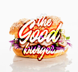 fresh bagel with meat, red onion, cream cheese, sprouts near the good burger lettering on white background
