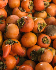 Top view at ripe persimmons. Vertical shot