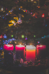 four burning advent candles background