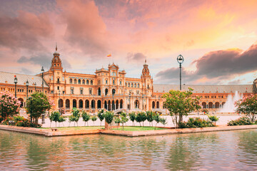 Obraz premium Seville, Spain. Famous landmark - Plaza de Espana in Seville, Andalusia, Spain. Renaissance Revival style. Spain Square. Altered Sunset Sky