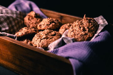 cookies on napkin in wooden box and dark background