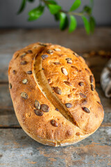 whole grain bread with pumpkin and sunflower seeds rye sourdough loaf gray dough organic portion on the table serving healthy meal snack ingredient top view copy spacefor text food background rustic