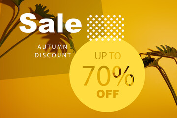 Tropical green leaves on yellow background with autumn sale illustration