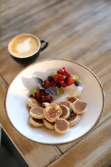 Tasty breakfast with berrieas and pancakes