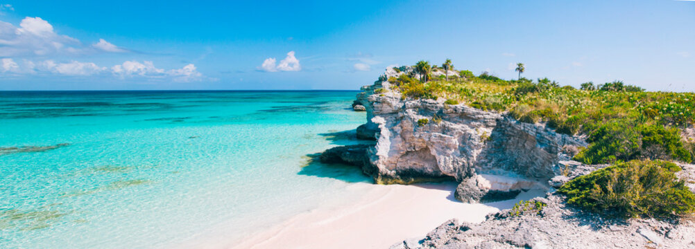 Scenic view of limestone cliffs on beach with turquoise sea water
