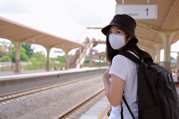 woman with a backpack with mask , after pandemic traveling