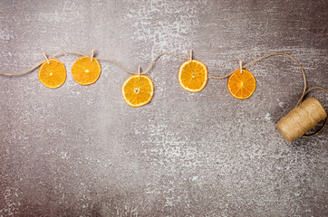 garland made from Homemade dried oranges with clothespins on twine